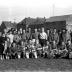 Voetbalclub Dentergem is kampioen: groepsfoto van spelers en bestuur, 1958